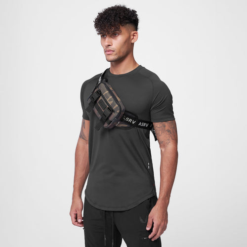 Small Crossbody Bag in Rust Camo worn across chest on model, front view