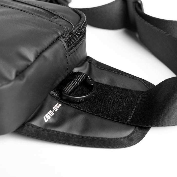 Flatlay water resistant small crossbody bag in black, detail view