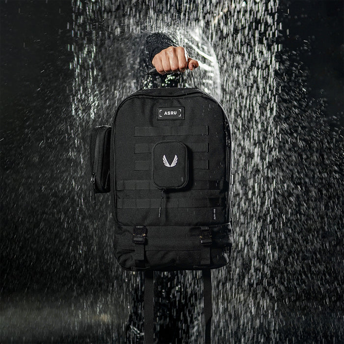 0275 Modular Everyday Pack in black, worn by person in rain
