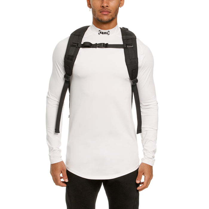 Modular Everyday Pack in black, worn on model's back with white long-sleeve shirt