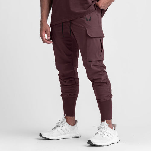 Tetra-Lite® Cargo High Rib Jogger in faded plum, modeled with white sneakers, front view
