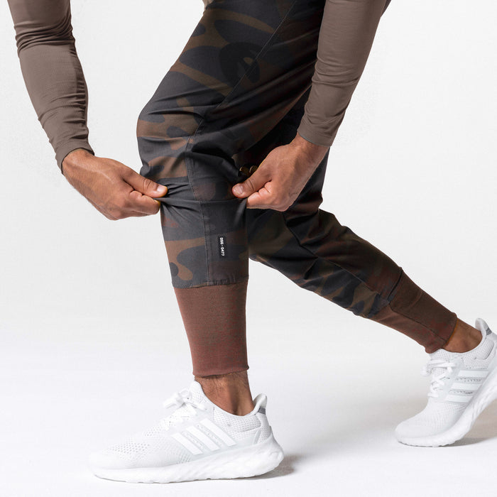 Tetra-Lite High Rib Jogger in rust camo, worn by model with white sneakers