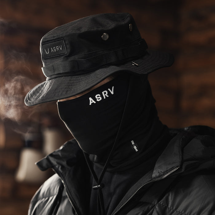Vented Boonie Hat in black, worn with neck gaiter and puffer jacket