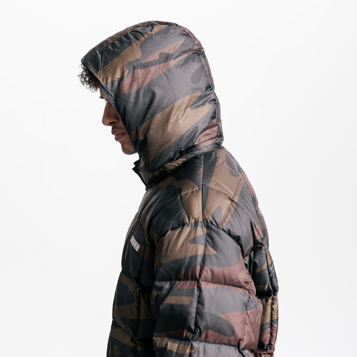 Weather-Ready Down Puffer Jacket in rust camo, worn by model in profile view with hood up