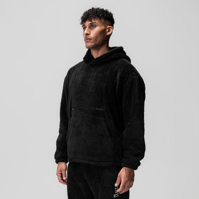 Black Sherpa Recovery Hoodie worn by model, three-quarter view