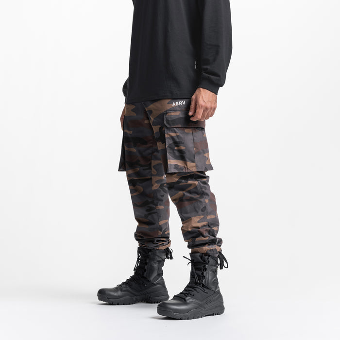 Weather-Ready Technical Cargo Pant in rust camo, worn with black boots, side view