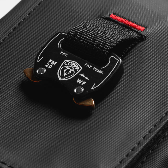 flatlay Waterproof Phone Holster Bag in black with red accent strap, overhead view
