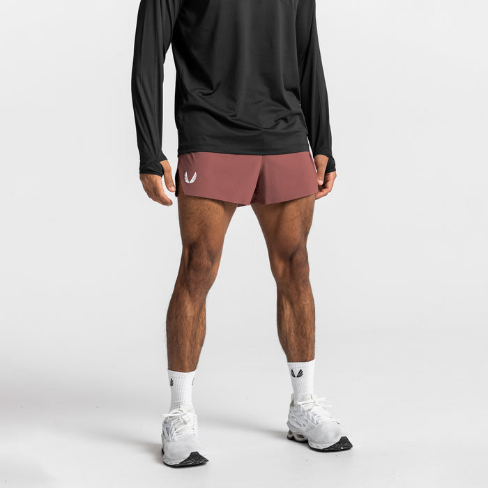 Tetra-Lite Laser Cut 3" Short in Canyon Rose, worn with black long-sleeve top and white sneakers