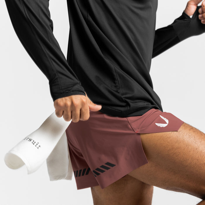 Tetra-Lite Laser Cut 3" Short in Canyon Rose, worn with black long sleeve shirt and white socks