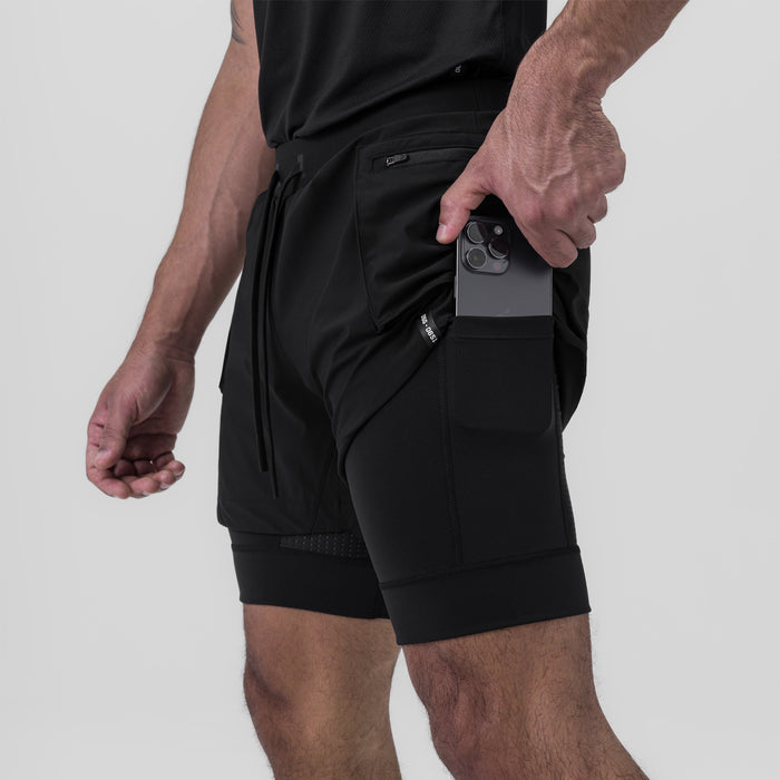 Tetra-Lite Liner Cargo Short in black, worn by model holding phone in pocket