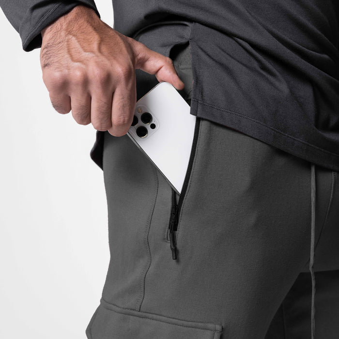 Tech-Terry Cargo High Rib Jogger in Raven, model holding white phone in cargo pocket