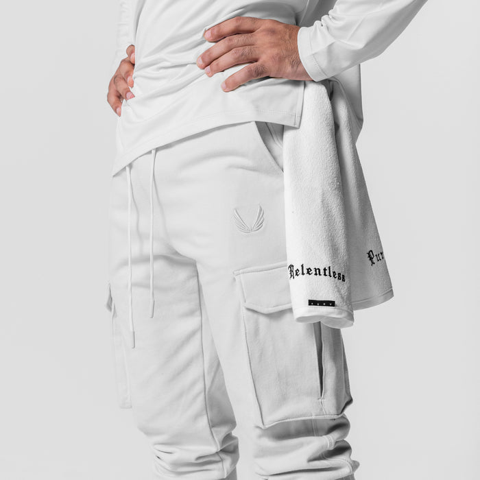 Tech-Terry Cargo High Rib Jogger in white, worn by model showing side view and cargo pockets