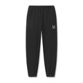 Flatlay of black Tech-Terry oversized sweatpants with ASRV emblem logo, front view