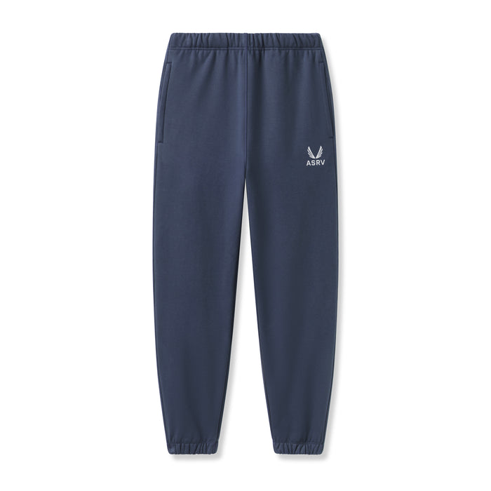Flatlay of ASRV Tech-Terry Oversized Sweats joggers in navy with emblem logo, front view