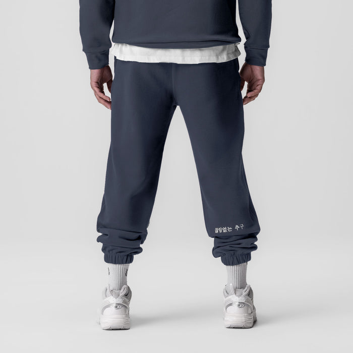 Tech-Terry Oversized Sweats in navy with white cuff detail, back view on model