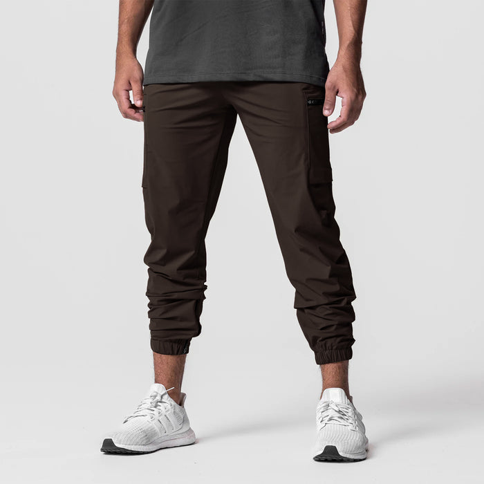 Dark brown Tetra-Lite Standard Zip Jogger worn with white sneakers, front view