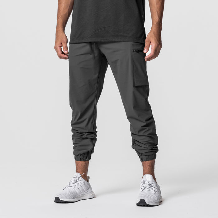 Tetra-Lite Standard Zip Jogger in space grey, modeled from waist down with white sneakers