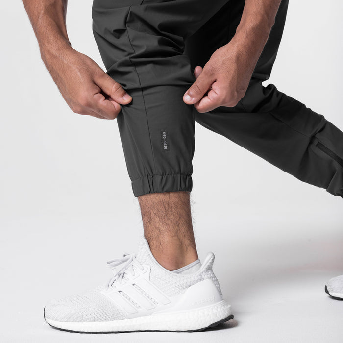 Tetra-Lite Standard Zip Jogger in Space Grey, worn with white sneakers, cropped view