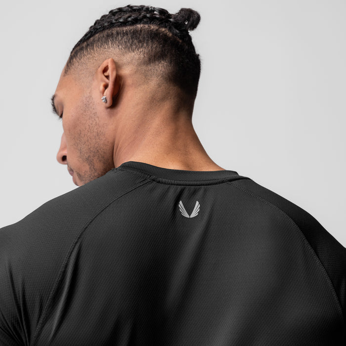 AeroSilver Established Tee in black worn by model, back view showing box logo
