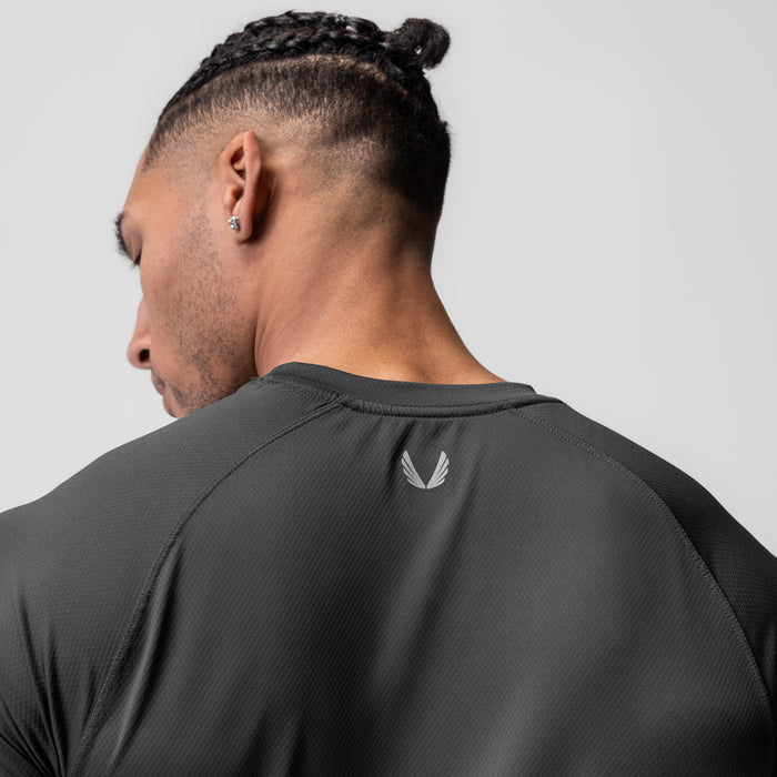 AeroSilver Established Tee in Space Grey, worn by model showing back view with logo detail