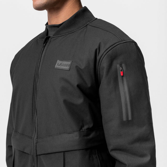 Kinterra Weatherproof Bomber Jacket in black, worn by model, side view