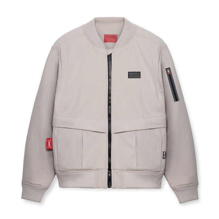 flatlay Kinterra Weatherproof Bomber Jacket in chai, front view
