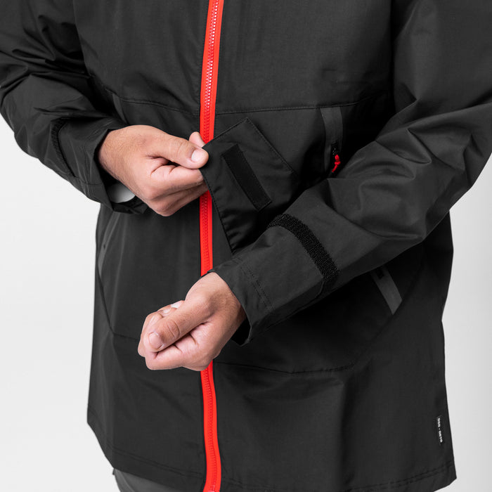Black Hipora AQUAzip Tech Parka worn by model, front view with red zip detail