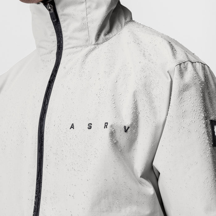 Hipora® Tech Parka in stone worn by model, front view with water droplets on fabric