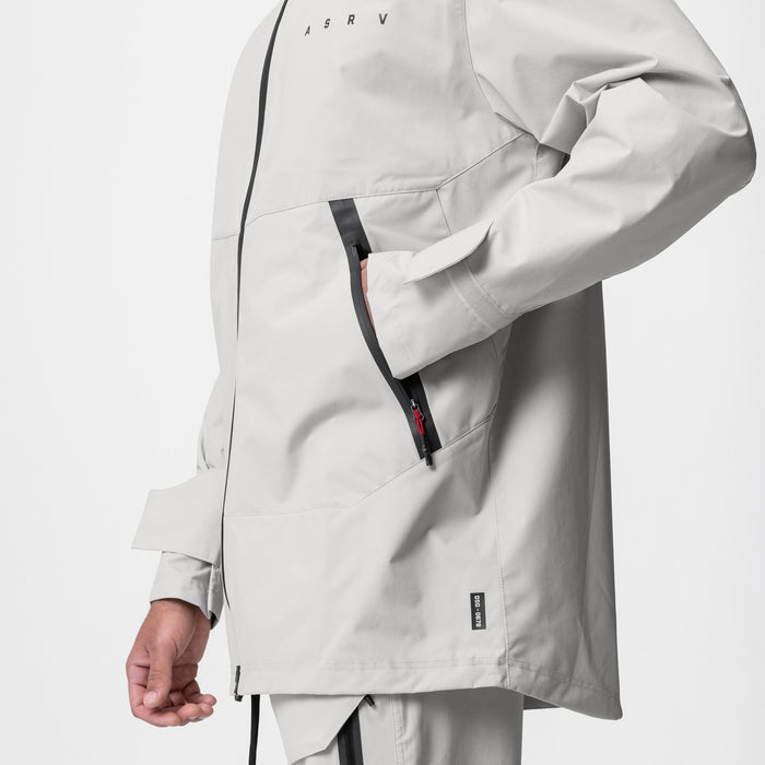 Hipora® Tech Parka in stone worn by model, side view showing zipper and pocket details