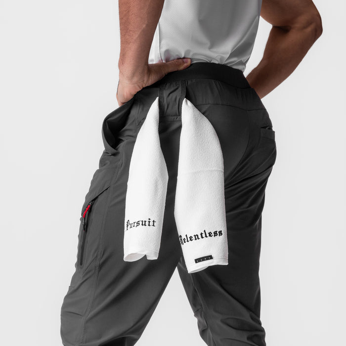 Tetra-Lite Tech High Rib Jogger in space grey, model holding white towel over shoulder