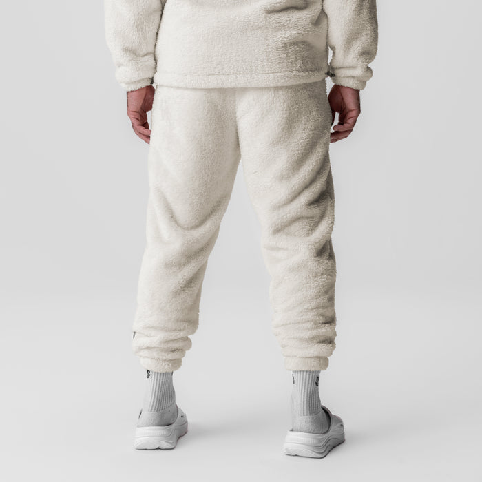 Sherpa Recovery Sweats in ivory cream worn by model, back view showing jogger fit and cuffs