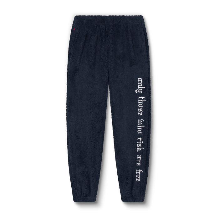 Flatlay of Sherpa Recovery Sweats joggers in navy with white text on leg, front view
