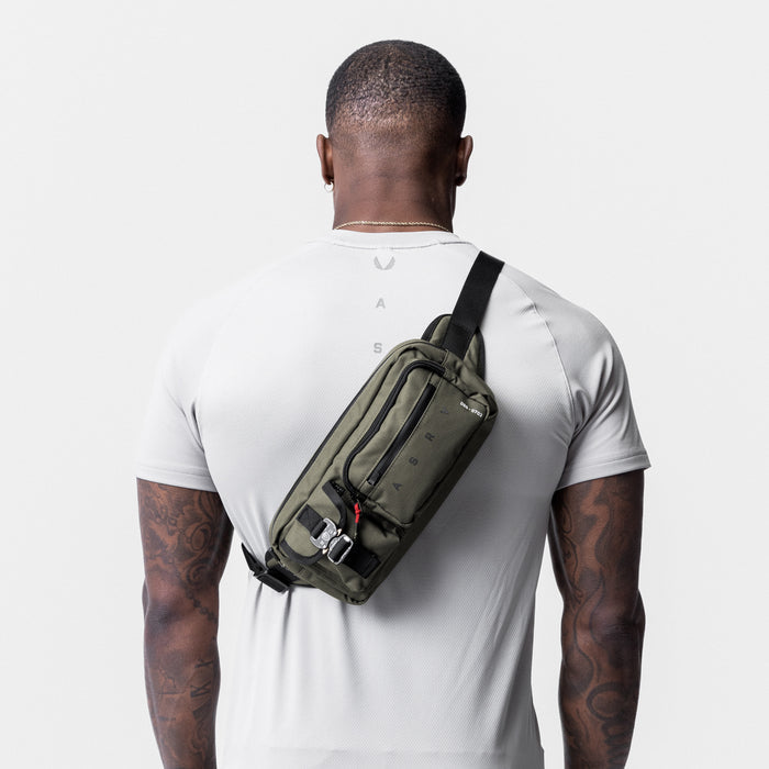 0703 Cordura Tech Crossbody Pack in Olive, worn across back of model