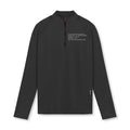 Flatlay of Core Fitted Quarter Zip in black with technical specs text, front view