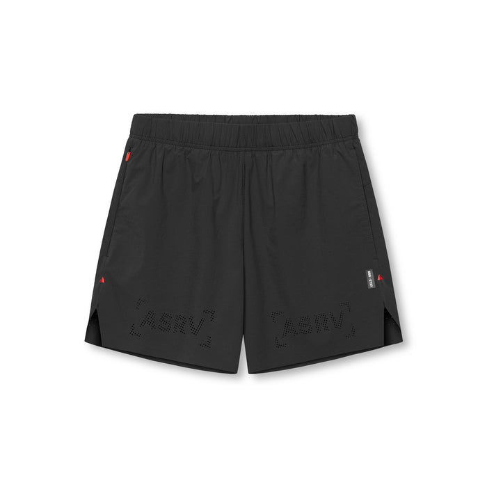 flatlay of black ripstop 6 inch perforated shorts with geometric cutout design, overhead view