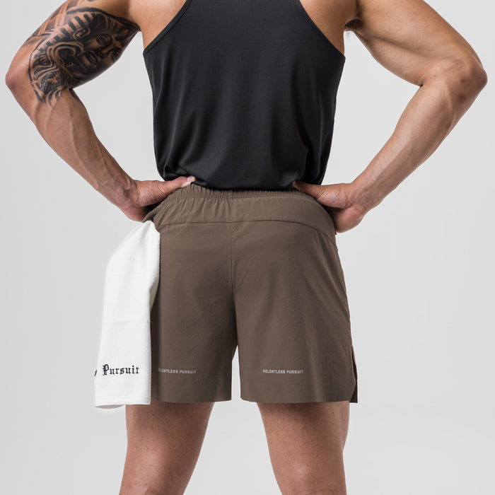 Ripstop 6" Perforated Short in Deep Taupe, back view on model with hands on hips