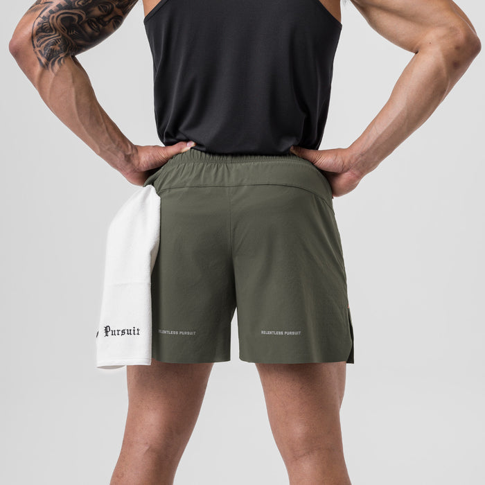 Ripstop 6" Perforated Short in olive with white underlay, back view on model
