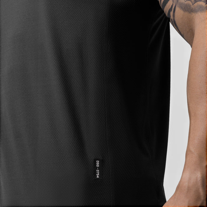 AeroSilver Training Singlet in black, worn by model showing side view with visible branding