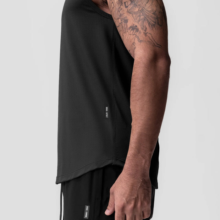 AeroSilver Cutoff Tank in black worn by model, side view showing sleeve and torso detail