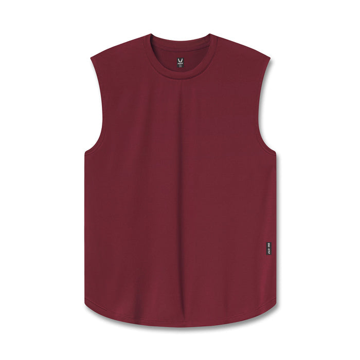 flatlay of a tank top in a deep burgundy red, displayed flat against a clean white background.