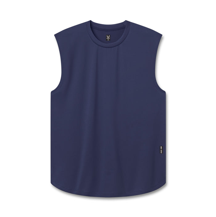 Flatlay of an athletic tank top in navy blue, shown flat against a white background.