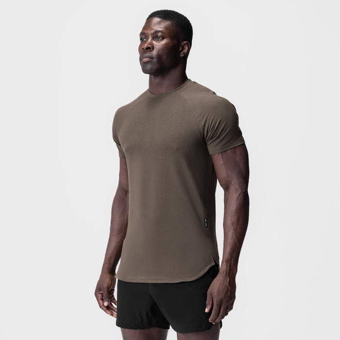 Deep taupe Supima® Established Tee worn by model with black shorts, side view