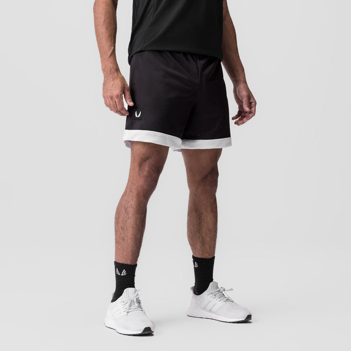 SilverPlus Mesh Reversible Short in black with white trim, worn by model, front view