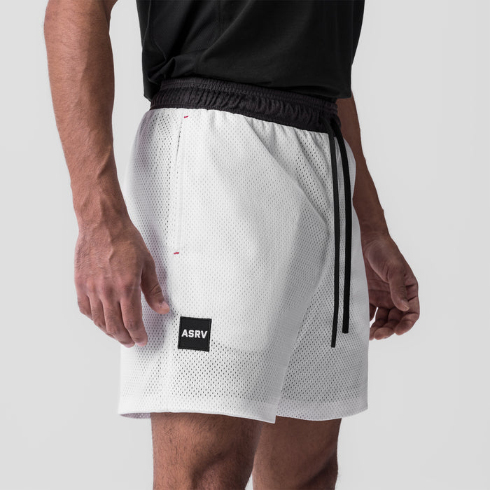 SilverPlus™ Mesh Reversible Short in white, worn by model, side view