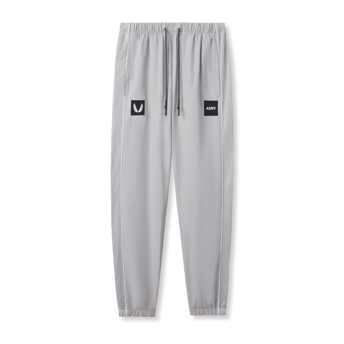 Flatlay of Ripstop Oversized Track Pant in slate grey with ASRV patches, front view
