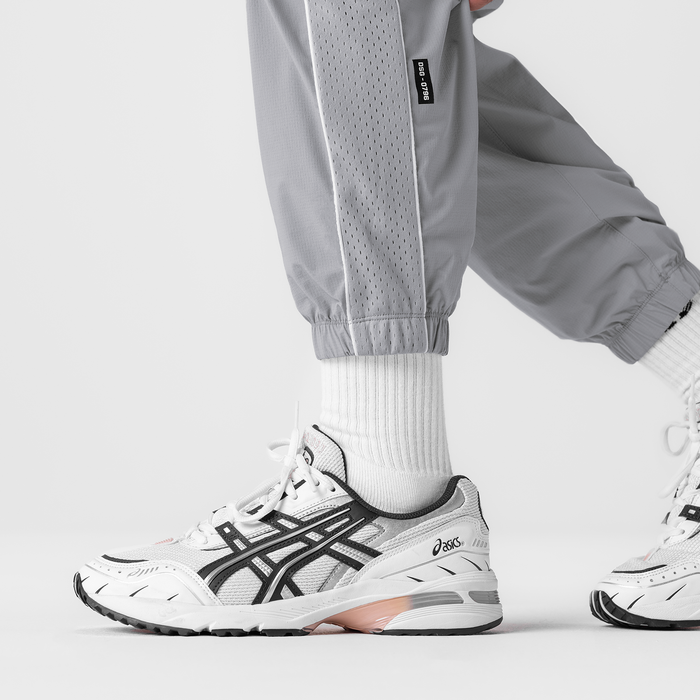 Ripstop Oversized Track Pant in slate grey worn with white socks and sneakers, lower body detail shot
