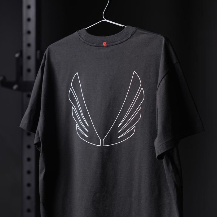 Black Tech Essential Relaxed Tee with white wing outline design on hanger