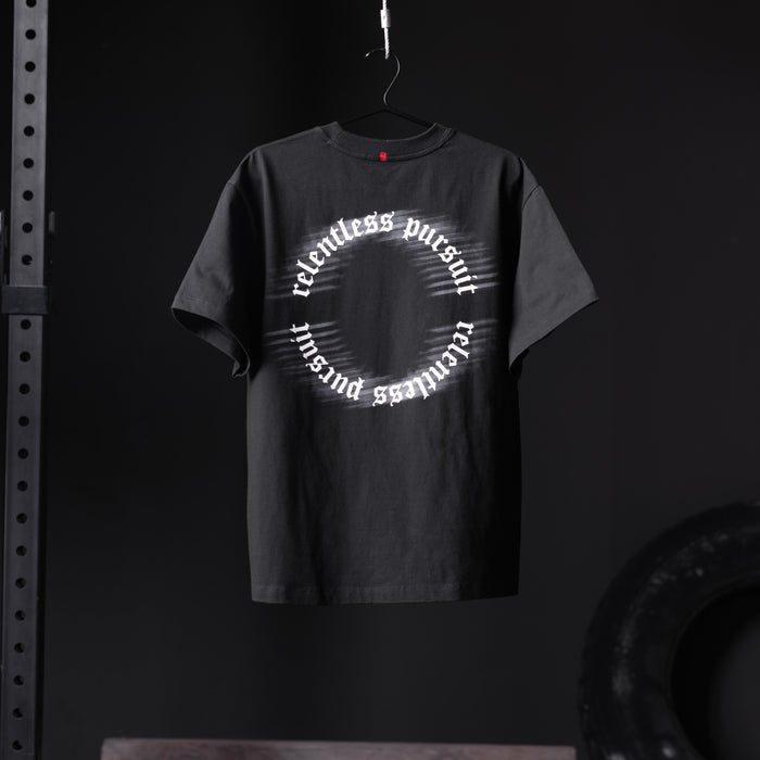 Black Tech Essential Relaxed Tee with 'RP Blur' circular text design, hanging on hanger