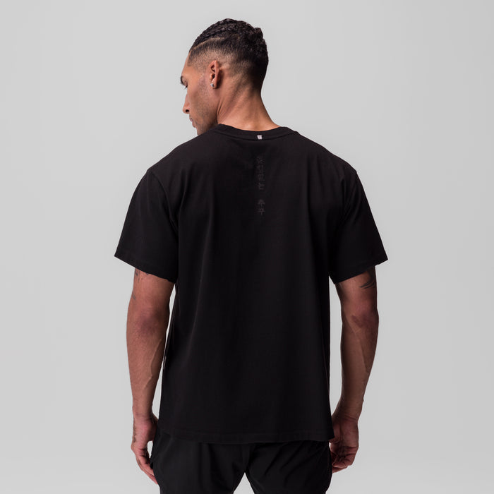 Black Tech Essential Relaxed Tee worn by model, back view