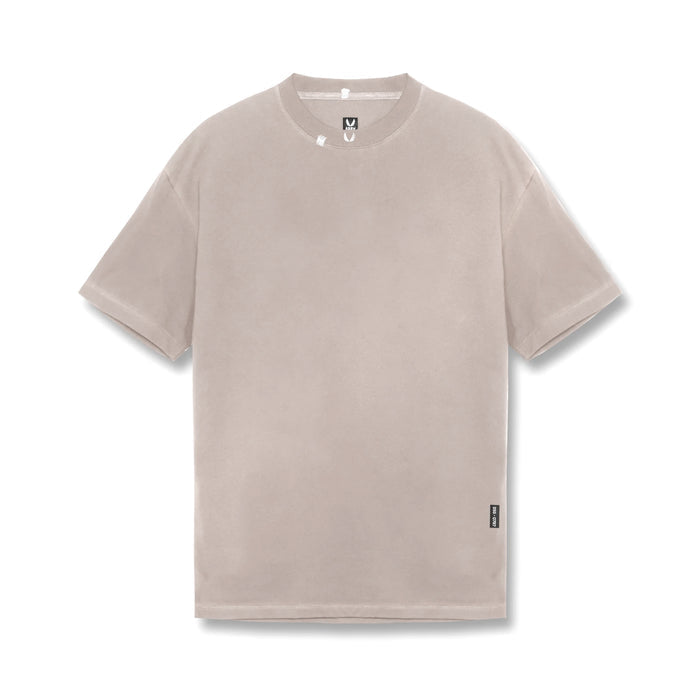 flatlay Tech Essential Relaxed Tee in faded chai, front view